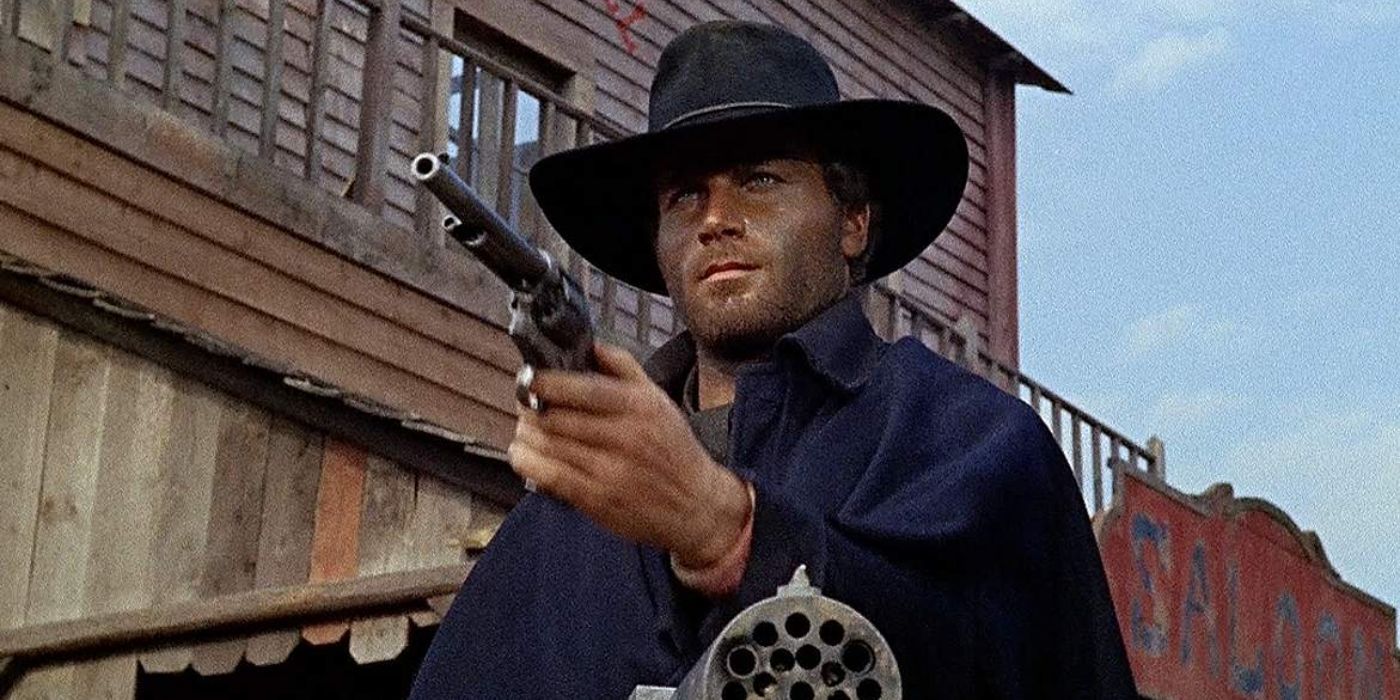 Franco Nero as Djano, wearing a dark cowboy outfit and pointing a revolver